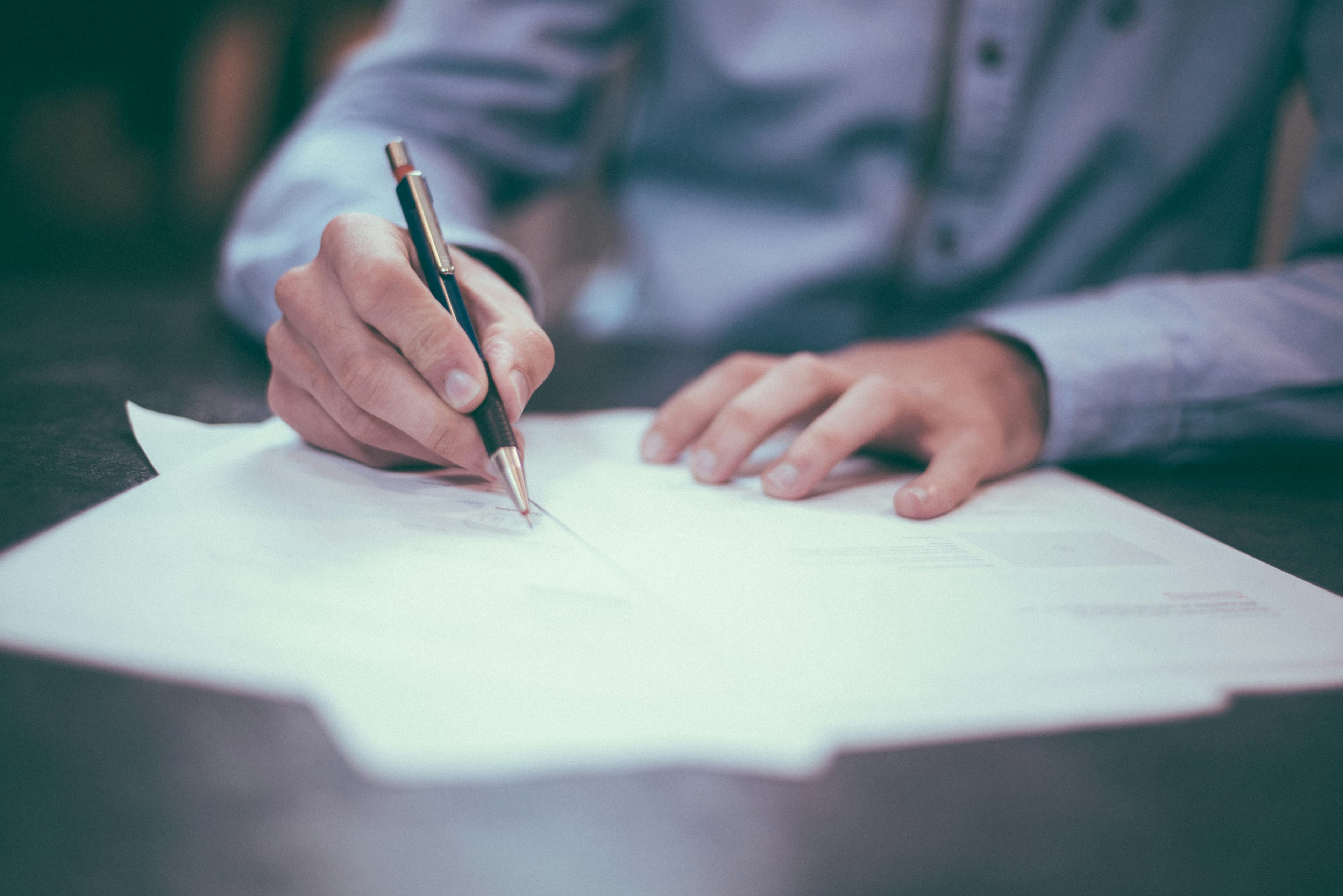 Attorney signing legal documents